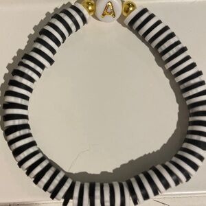 Striped Black and White Bracelet with Gold Accents